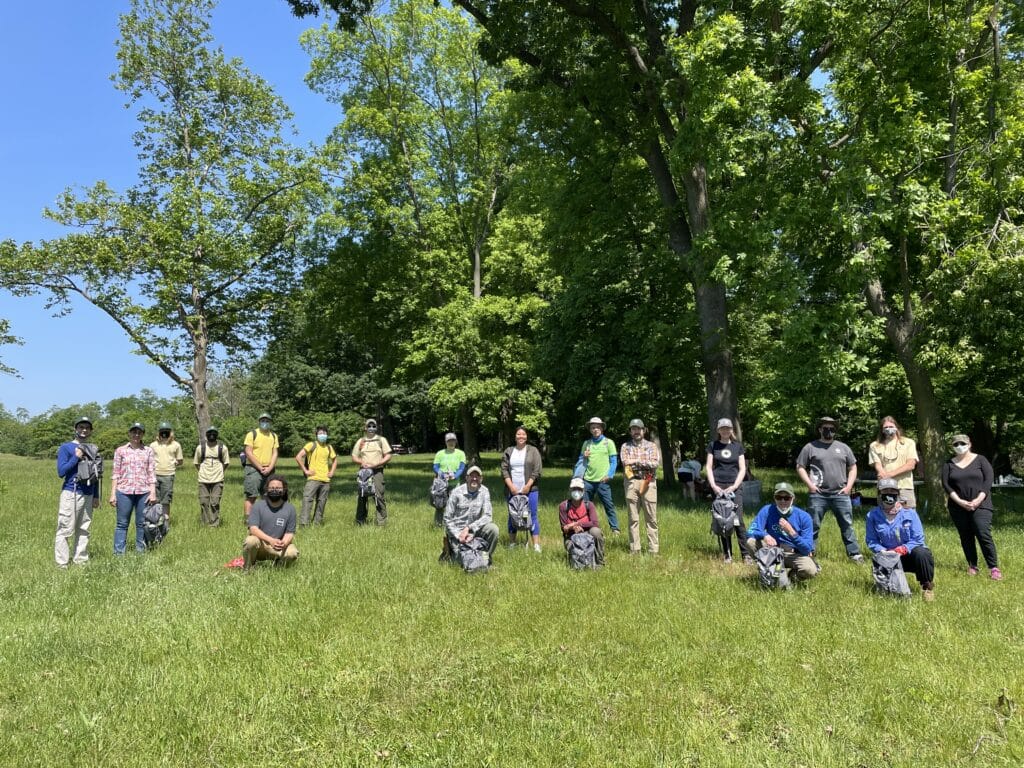 Group of trail maintainer volunteers in a field
