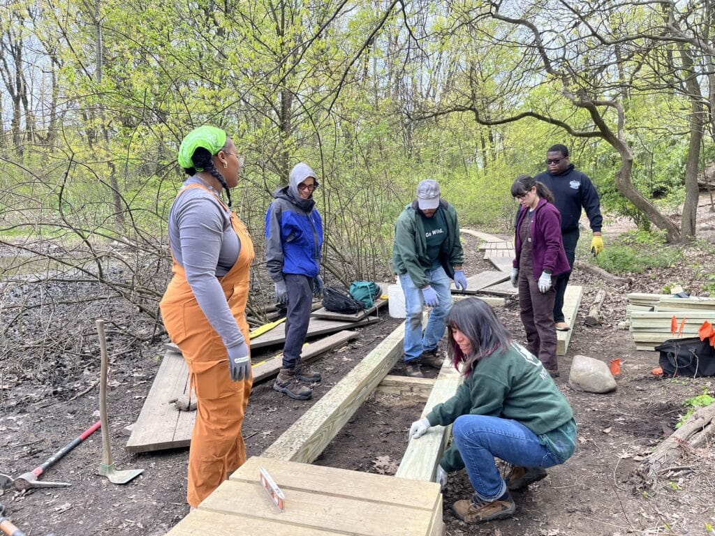 NAC staff installing puncheon in forest park