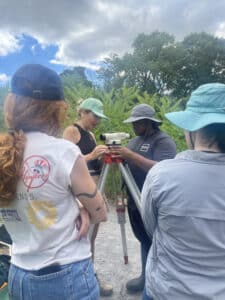 group of interns around elevation measurer