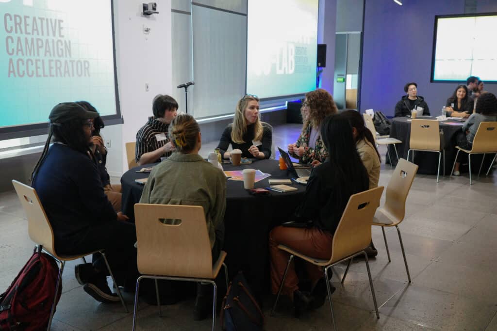 group sits around table