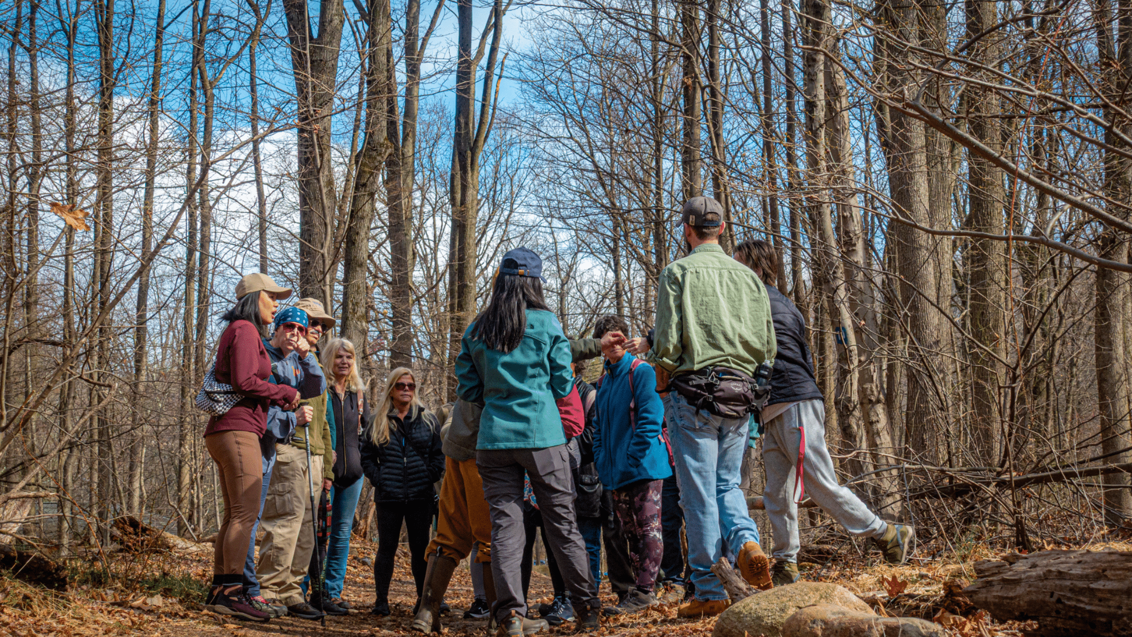 people standing on trail